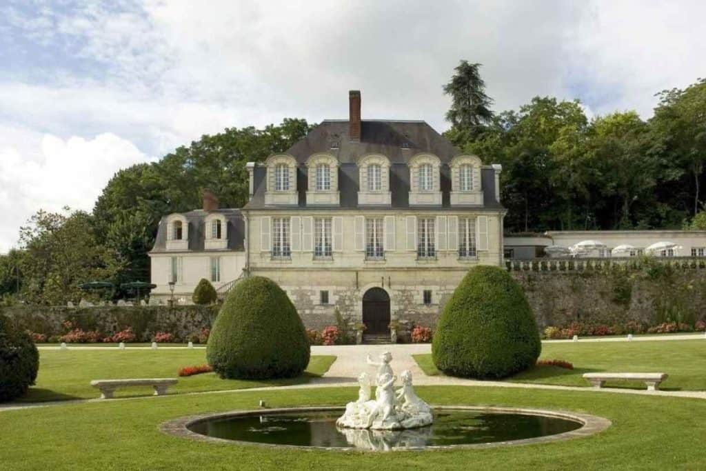 Exterior of Château de Beaulieu Magnolia in France with classic architecture and garden surroundings