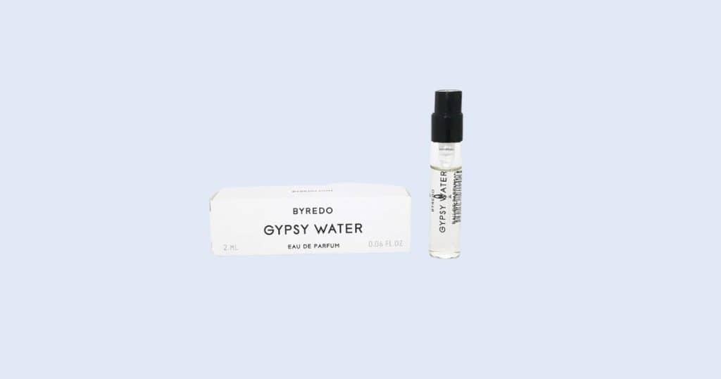 Byredo Gypsy Water travel spray perfume on light blue background