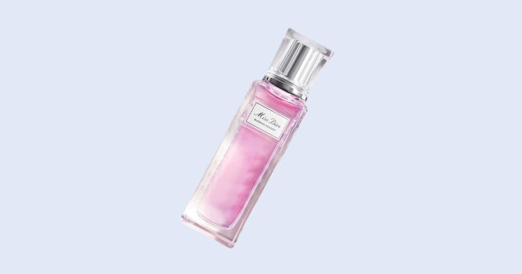 Dior Miss Dior Blooming Bouquet rollerball perfume on light blue background