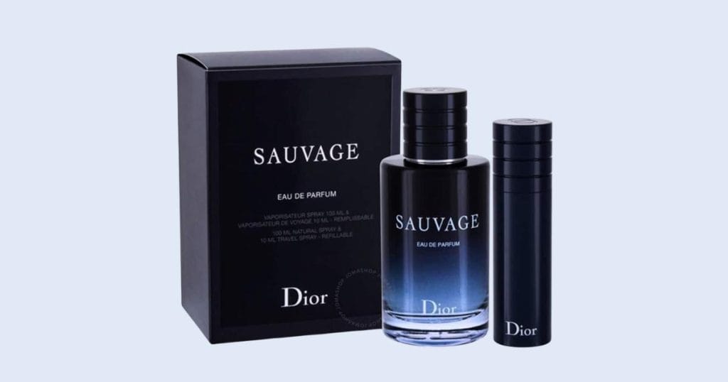 Dior Sauvage travel spray cologne on light blue background