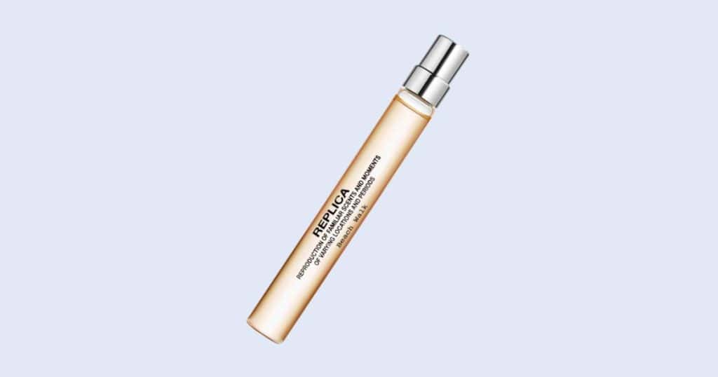 Maison Margiela Replica Beach Walk mini spray perfume on light blue background